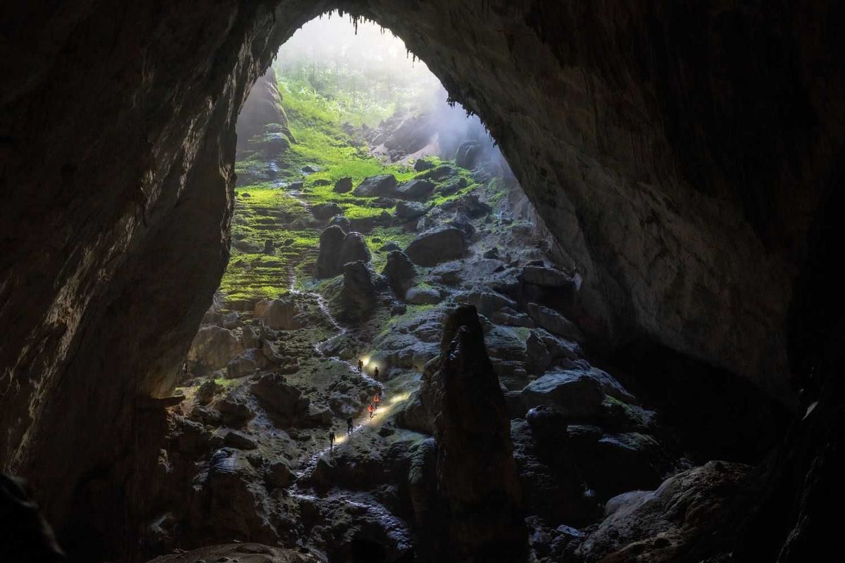 Son Doong expedition travelers trek 25 kilometers across mountains, trails, rivers, streams, and rocky cave walls.